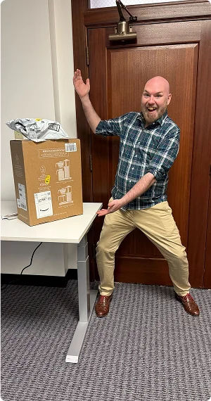 Mike Julian smiling with packages