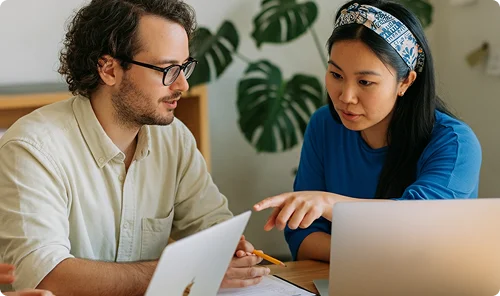 Couple working at computer together